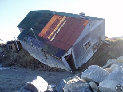 Falling House, Photo courtesy of the Shishmaref Erosion and Relocation Commission