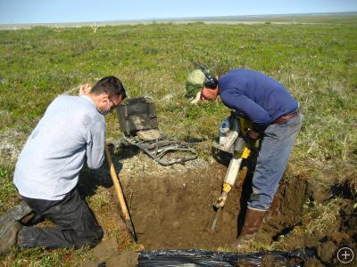 Digging in permafrost. Photo by Nick Bonzey.